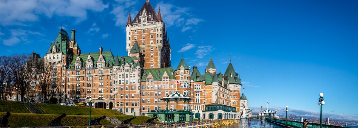 A green-roofed, red brick luxury hotel in Quebec, Canada