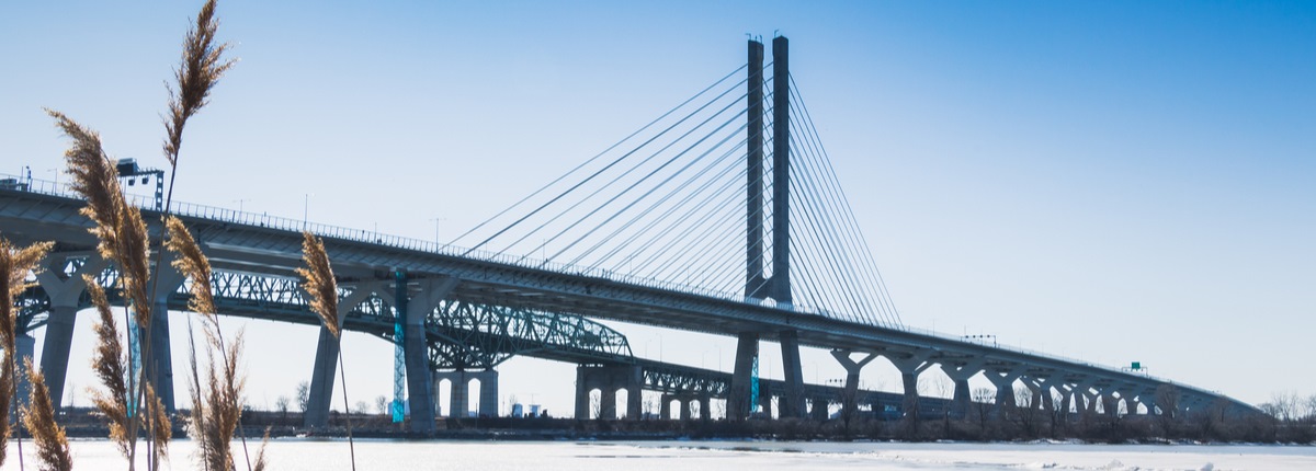 A cable-suspended bridge across a river in Montreal, Quebec, Canada