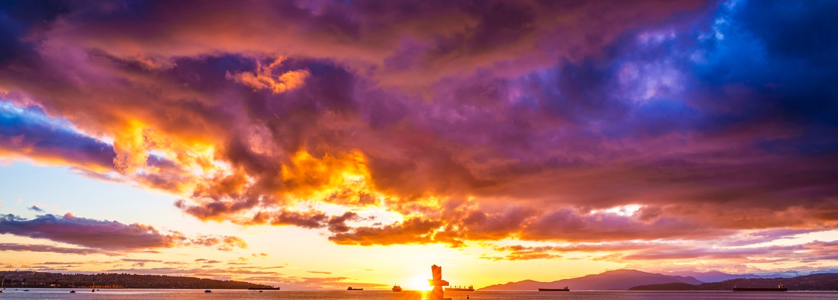 A dramatic sunset in a cloudy sky